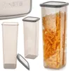 A collection of transparent food storage containers with gray lids, one filled with pasta. Podgląd zdjęcia produktu