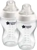 Two clear baby bottles with white caps and measurement markings. Produktbild-Vorschau