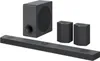 A set of LG soundbar speakers including a soundbar, a subwoofer, and two satellite speakers, arranged on a white background. Produktbild-Vorschau