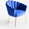 A blue velvet armchair with gold legs against a white background. Produktbild-Vorschau