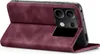 A burgundy flip case for a smartphone, shown open and standing on its side. Produktbild-Vorschau