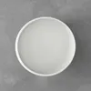 A white bowl is shown from a top-down view on a gray textured background. Náhľad obrázku produktu