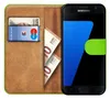 A book-style phone case with a Samsung Galaxy S7 phone inside, along with euro banknotes and a bank card. Produktbild-Vorschau