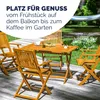 A wooden garden table and chairs set on a wooden deck, with a hammock and garden in the background. Produktbild-Vorschau