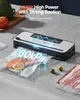 A vacuum sealer is shown in operation, sealing a piece of salmon in a plastic bag. The scene is set on a countertop with some food items like broccoli, tomato, limes, and bacon visible. Produktbild-Vorschau