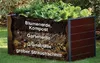 A cross-section of a raised garden bed showing different layers of soil and organic matter, with plants growing on top. Produktbild-Vorschau