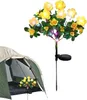 A solar-powered flower light is placed next to an open tent. Náhled obrázku produktu