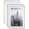 A stack of picture frames with a cityscape image in the foreground. Produktbild-Vorschau