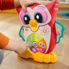 A child's hands are interacting with a Fisher-Price learning owl toy. Náhled obrázku produktu