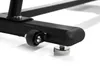 Close-up of the base of a black exercise bike, showing a wheel and a leveling foot. Podgląd zdjęcia produktu