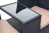 A close-up view of a black poly-rattan bench with a glass tabletop and a beige cushion. Produktbild-Vorschau