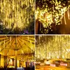 Collage of four images showing yellow meteor shower lights decorating trees, an outdoor seating area, and a street at night. Náhled obrázku produktu