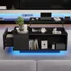 A modern black coffee table with LED lighting is shown in a living room setting, with a sofa in the foreground. Produktbild-Vorschau