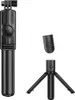 A black selfie stick with a tripod base and a detachable remote control, all displayed against a white background. Podgląd zdjęcia produktu
