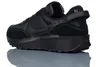 A black Nike Waffle Debut sneaker is shown from the side on a white background. Náhled obrázku produktu