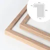 A close-up view of a wooden picture frame, with a diagram showing its dimensions. Produktbild-Vorschau