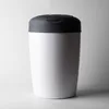 A white diaper pail with a gray lid is shown against a light gray and white background. Voir les images du produit