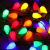 A close-up view of a string of colorful LED Christmas lights. Produktbild-Vorschau