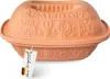 A terracotta Römertopf casserole dish with a lid, decorated with embossed patterns of fish, trees, and a chicken. A white tag with German text hangs from the dish. Produktbild-Vorschau
