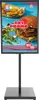 A digital display stand showing a promotional advertisement for a food item. Podgląd zdjęcia produktu