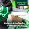 A person wearing black gloves is using a green mini chainsaw to cut a piece of wood. The product is shown in action, highlighting its cutting capability. Produktbild-Vorschau