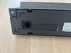 The bottom and side of a dark gray electronic device. Anteprima dell’immagine prodotto