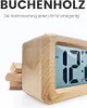 A close-up marketing shot of a wooden digital alarm clock with its display showing the time. Produktbild-Vorschau