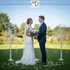 A wedding ceremony taking place outdoors with a bride and groom. Podgląd zdjęcia produktu