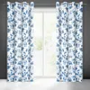 Two floral patterned curtains hanging in front of a window. Anteprima dell’immagine prodotto