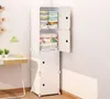 A white modular storage cabinet with folded clothes and blankets inside, placed in a corner of a room next to a desk with a lamp and plants. Anteprima dell’immagine prodotto