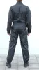 A person wearing a black jumpsuit, viewed from the back. Náhled obrázku produktu
