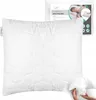 A white quilted pillow is shown in the foreground, with its packaging in the background. A hand is shown pulling out some of the pillow's filling. Produktbild-Vorschau