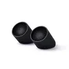 Two black cylindrical objects with a honeycomb pattern inside and ribbed exteriors are shown against a white background. Podgląd zdjęcia produktu