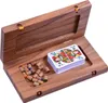 An open wooden box containing a deck of playing cards and colorful game pieces. Produktbild-Vorschau