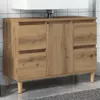 A wooden bathroom vanity cabinet with a white sink on top, set against a tiled wall. Náhľad obrázku produktu