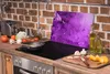 A kitchen scene with a glass cutting board on a stovetop. Náhled obrázku produktu