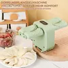 A light green electric dumpling maker is shown next to a bowl of filling and a plate of uncooked dumplings. Produktbild-Vorschau