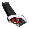 A red lawnmower partially covered by a black and silver cover, isolated on a white background. Produktbild-Vorschau