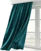 A teal velvet curtain is draped in front of a window. Produktbild-Vorschau