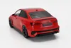 A red Audi RS3 model car is shown from a rear-quarter angle on a white background. Produktbild-Vorschau