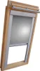 A close-up view of a wooden framed skylight window with a silver-gray roller blind partially lowered. Produktbild-Vorschau