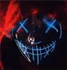 A close-up of a person wearing a red hoodie and a glowing blue LED purge mask. Produktbild-Vorschau
