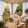 A cozy and inviting outdoor patio with a hammock, plants, and string lights. Náhled obrázku produktu