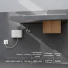 A white water heater mounted on a gray wall under a concrete shelf, with technical specifications displayed below. Produktbild-Vorschau