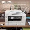 A Brother printer is shown on a wooden desk with office supplies. Voir les images du produit