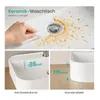 A collage of images showing a ceramic sink, its ease of cleaning, and its dimensions. Voir les images du produit