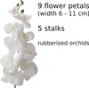 A close-up of white artificial orchids with descriptive text on the right. Voir les images du produit