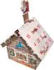 A Christmas advent calendar shaped like a house, decorated with snow and festive imagery. Produktbild-Vorschau