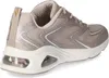 A side view of a beige Skechers sneaker with glitter accents and a visible air cushion in the sole. Voir les images du produit