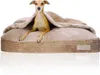 A dog is lying on a dog bed under a blanket. Produktbild-Vorschau